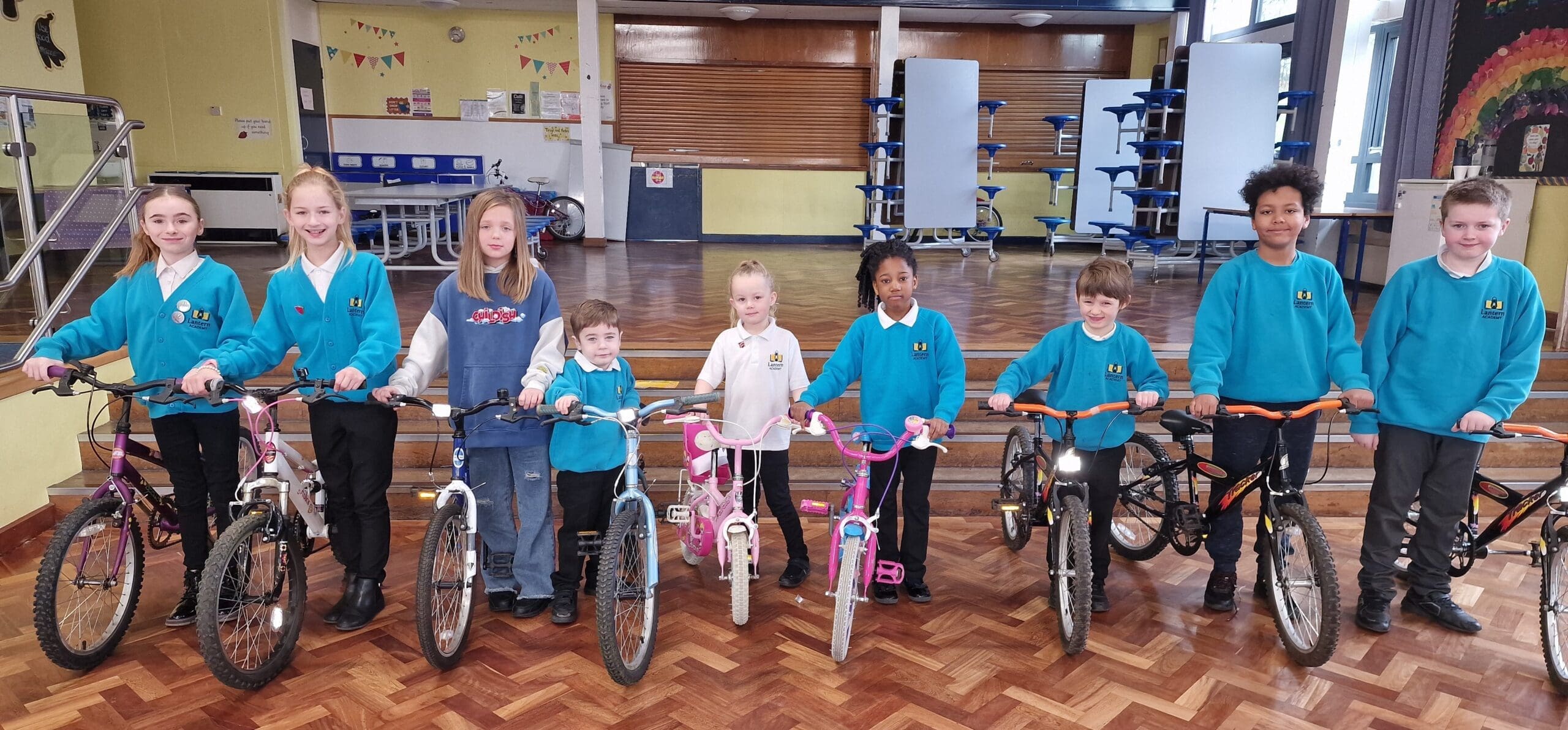 Pupils from Lantern Academy with the donated bicycles scaled